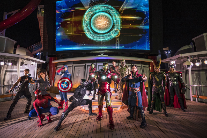 Actors dressed up as Marvel characters stand together