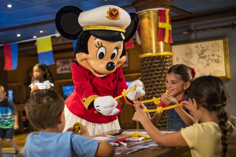 Minnie Mouse playing with children aboard the ship 