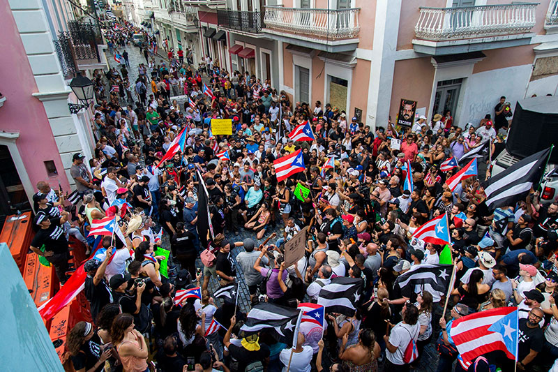 Demonstrators protest against Gov Ricardo Rossello in San Juan Puerto Rico 