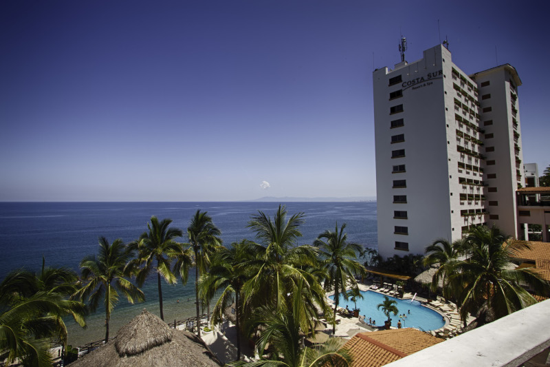 Exterior of the towering hotel overlooking the sea 