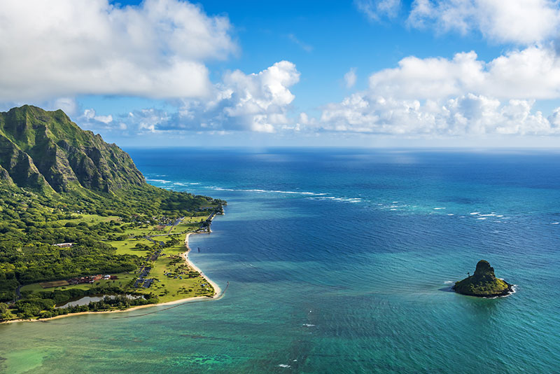 Aerial view of Kualoa Point and Chinamans Hat at Kaneohe Bay Oahu Hawaii USA
