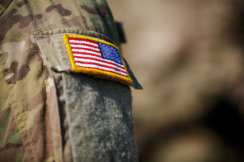 USA flag and US Army patch on solders uniform