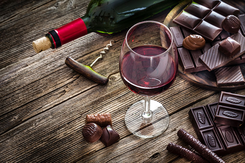Red wine and dark chocolate on a table