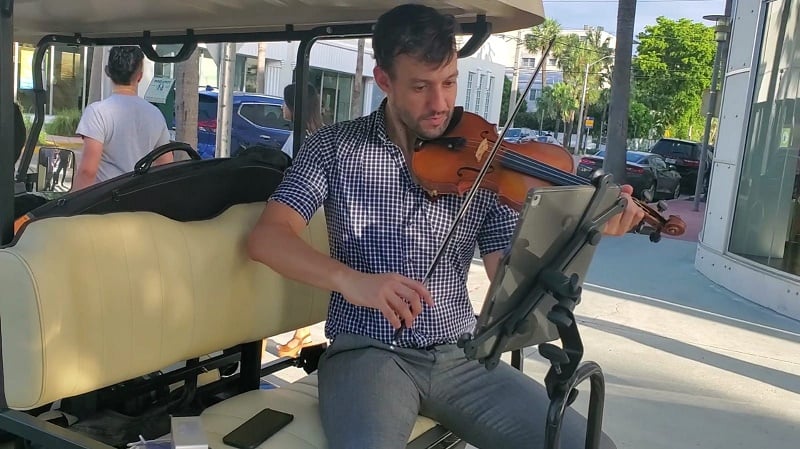 Lincoln Road Entertainment District of Miami Beach Orchestra Musician on Golf Cart