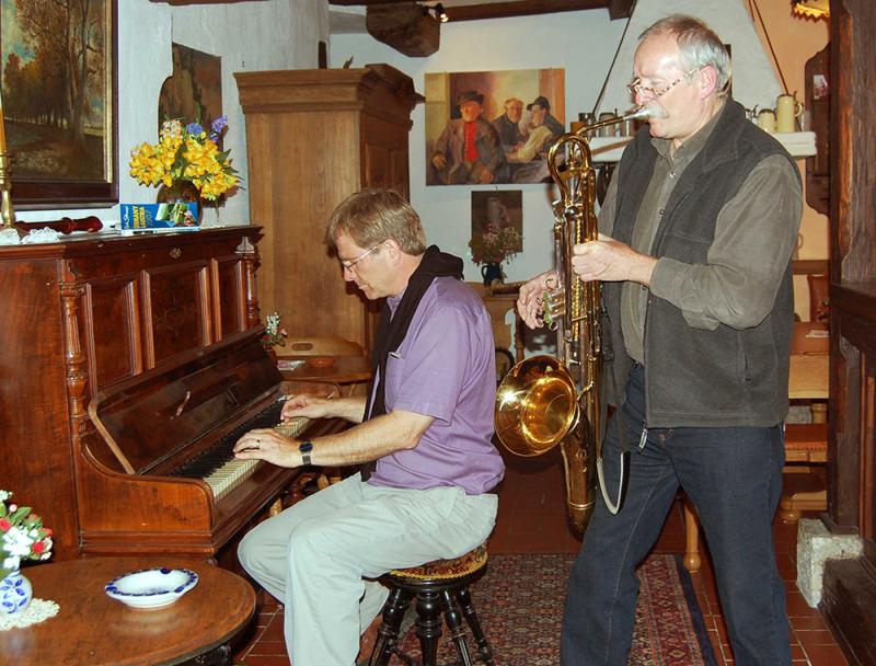 Rick Steves plays piano with Rothenburg resident Norry playing his "Norryphone"