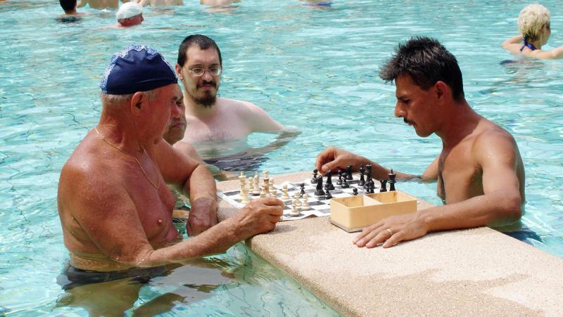 Locals in Budapest playing chess in a hot spring