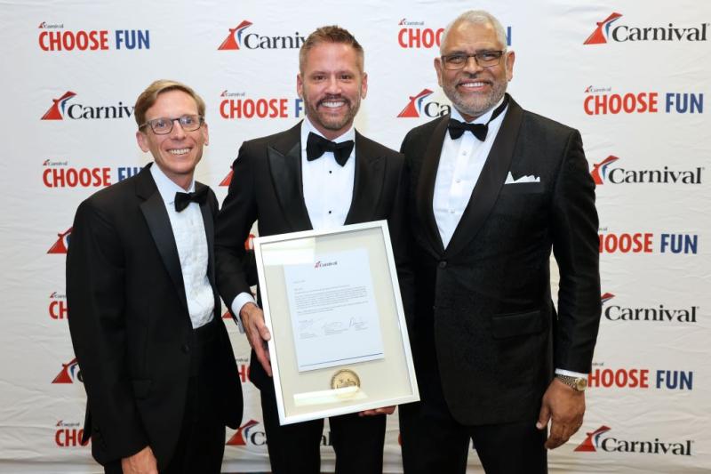 Adolfo Perez (center) is honored with CLIA's Lifetime Achievement Award and inducted into CLIA's Hall of Fame. Carnival executives Ken Tate (left) and Arnold Donald (right) congratulated Perez on the honor. 