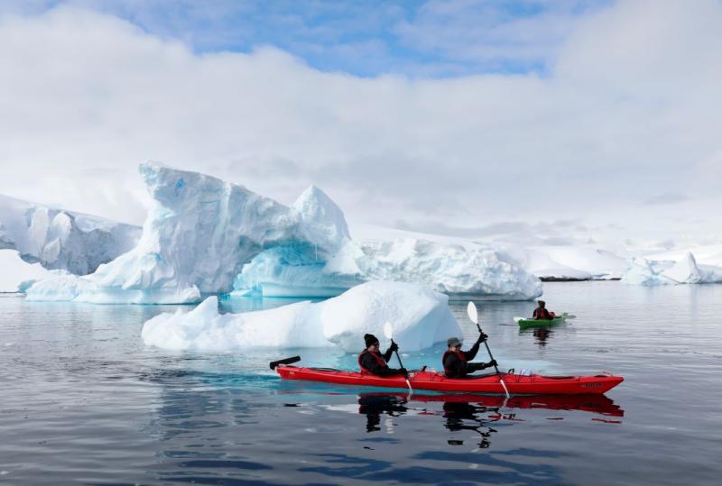 Atlas Ocean Voyages guests head out kayaking near Enterprise Island, Antarctica.