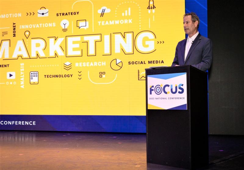 Brad Tolkin, co-chairman/co-CEO, World Travel Holdings, talks to 600 travel advisors attending the 2024 national "Focus" conference of Dream Vacations and CruiseOne.