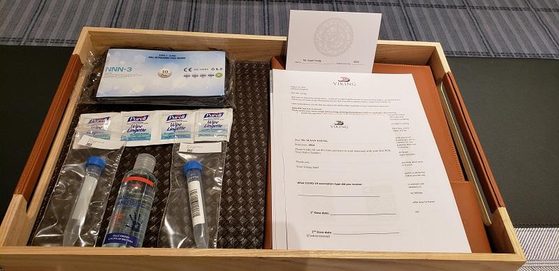 This is placed in every accommodation on Viking's ships, with vials for PCR saliva testing, hand sanitizer, masks and more. 