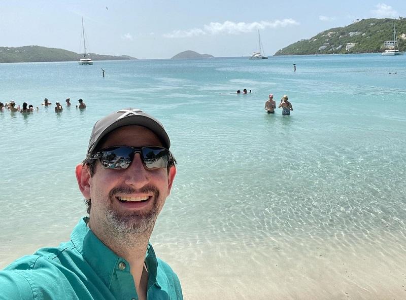 Danny Genung, CEO of Harr Travel, a Nexion Travel Group member, Redlands, CA,  is shown at Magen's Bay in St. Thomas, USVI.