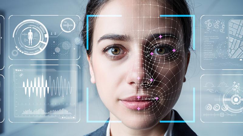 A woman whose face is being scanned by biometrics