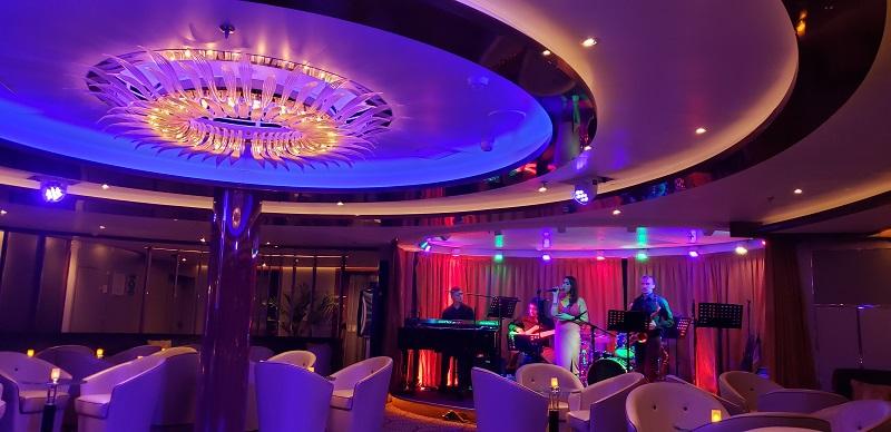 The Band and Grace perform in Seabourn Ovation's Club Lounge