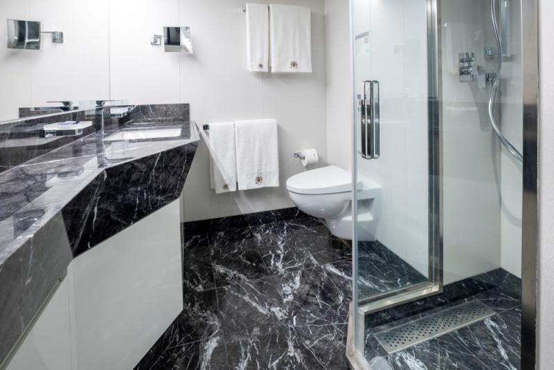 MSC Seascape's Deluxe Veranda Stateroom has a marble bathroom with large shower.