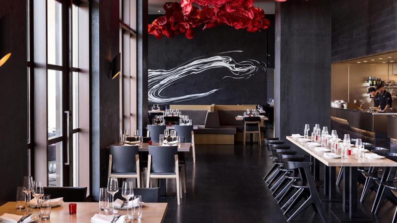 A restaurant with modern black and red decor