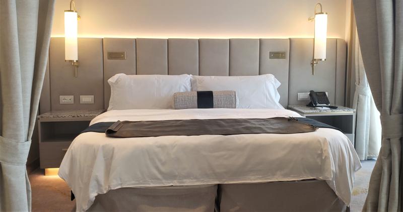 Bedroom area of #8073, newly configured Sapphire Veranda Suite, on Crystal Serenity.