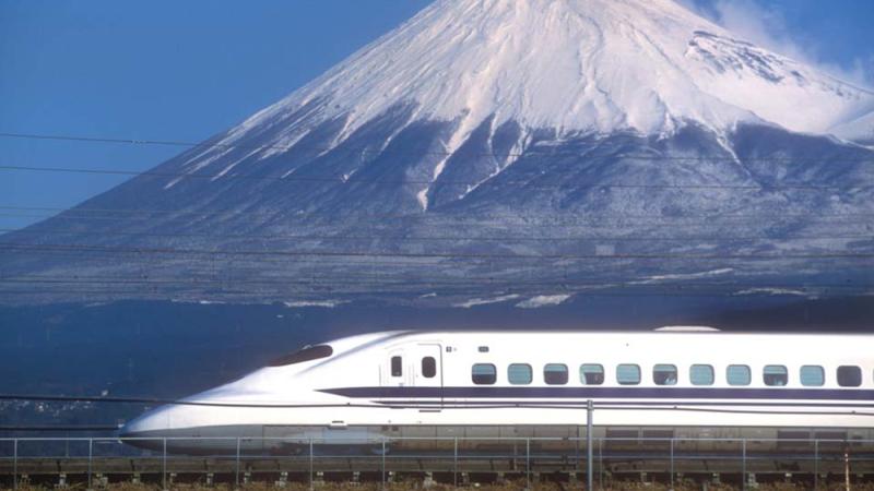 Bullet train passing Mount Fuji