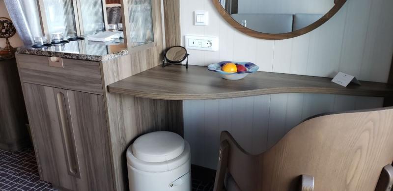 The desk area and cabinetry in the living room of #823 on Seabourn Venture.