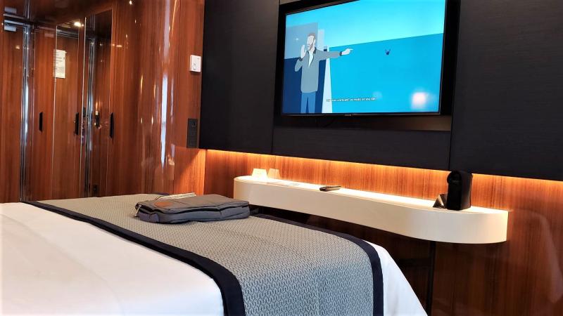 Flat-screen, wall-mounted TV in #540, Horizon (A2) stateroom, World Traveller, Atlas Ocean Voyages.