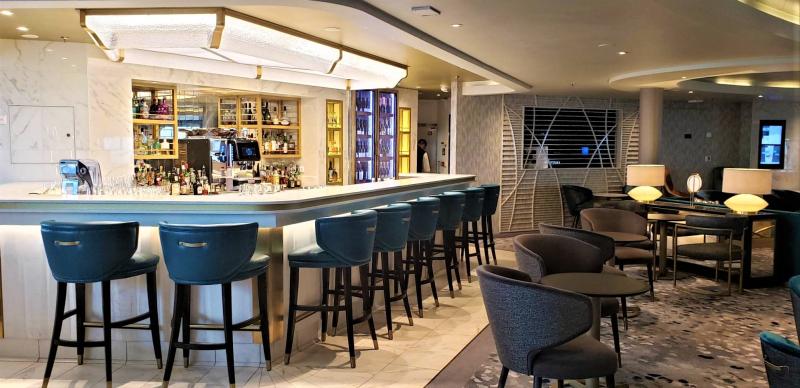 The bar and a portion of the seating area within Silver Endeavour's Explorer Lounge.