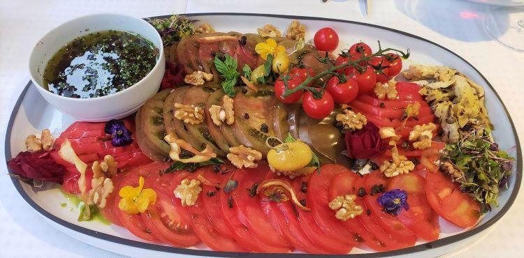 Heirloom tomatoes selected by the Gastronomic Guest at a Sete, France, local market, showed up as a plate during a private group dinner on World Traveller.
