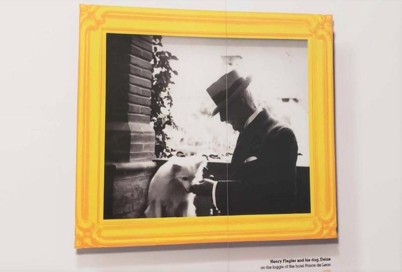 One wall at the Fort Lauderdale Brightline station is covered with copies of historic photos. Most show railroad baron Henry Flagler of the historic Florida East Coast Railway. Here Flagler is with his dog. Today's Brightline service uses the historic right-of-way once used by that historic railway.
