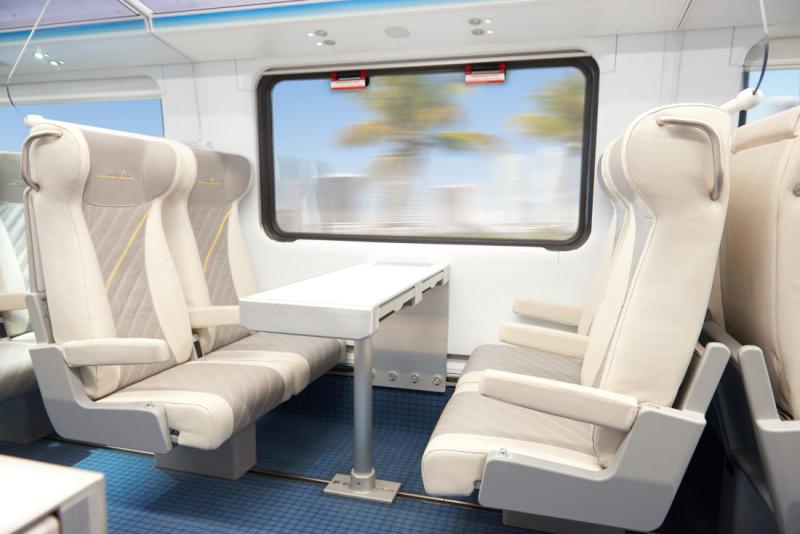 Smart (economy) class guests can opt for a variety of seating including quad seats with a table between. Small trays for each seat also pull up from under the table. 