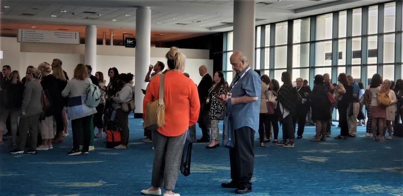 Advisors wait outside the ballroom at the Greater Fort Lauderdale/Broward County Convention Center -- ready to enter for the start of Cruise360.