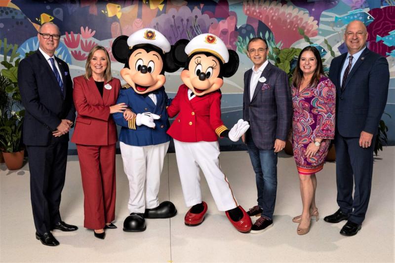 At new Disney terminal at Port Everglades, FL, are, left to right: Lamar P. Fisher, Broward County Mayor, Sharon Siskie, Disney Cruise Line Senior Vice President & General Manager, Captain Mickey and Captain Minnie, Thomas Mazloum, President New Experience Portfolio & Disney Signature Experiences, Monica Cepero, Broward County Administrator, and Jonathan Daniels, Port Everglades CEO and Port Director. 