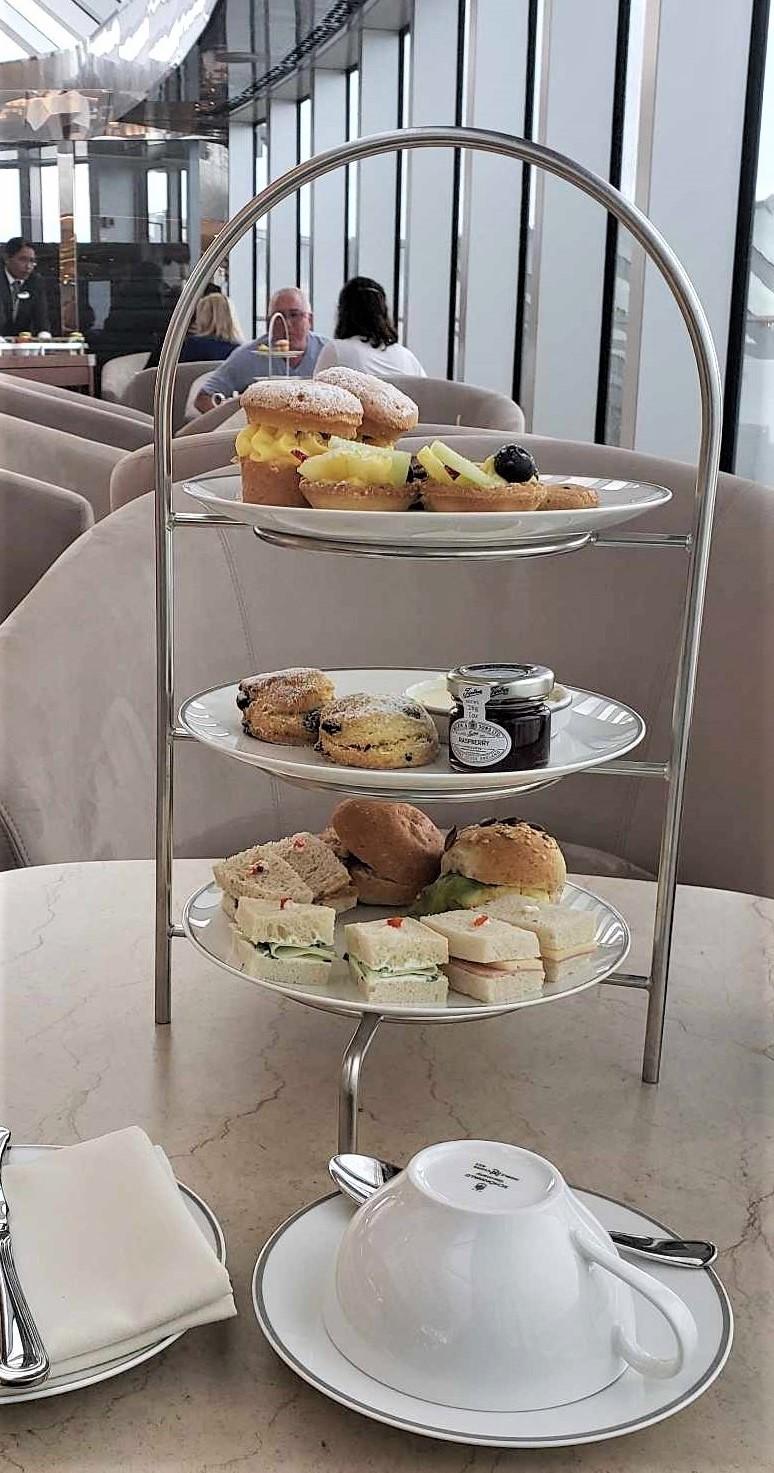 Afternoon tea is served in the MSC Yacht Club's Top Sail Lounge on MSC Seascape.