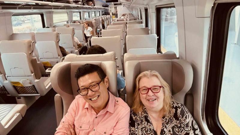 On our Fort Lauderdale-to-Orlando Brightline trip, we picked two seats facing two others with a table between. Shown are Susan Young, cruise editor, TravelAgentCentral.com, and Harrison Liu, a travel industry friend. 