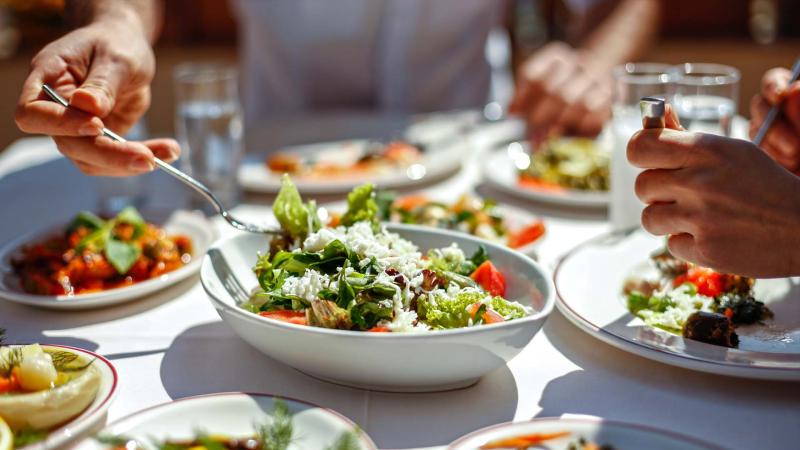 Friends gather for a vegetarian meal