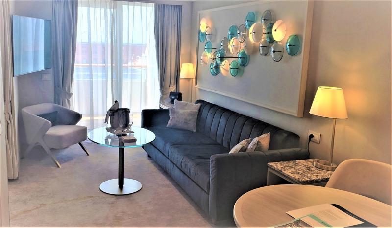 Living area of the new configuration of the Sapphire Veranda Suite, #8073 on Crystal Serenity. 