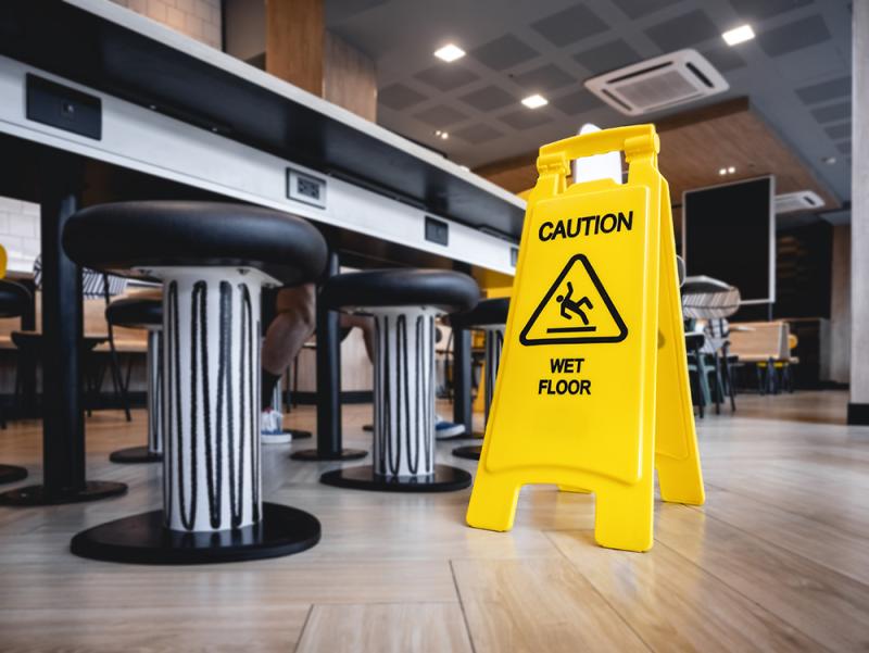 slips falls accidents wet floor sign