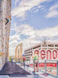 A climber looks up at the climbing wall at the Whitney Peak Hotel/Reno