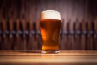 beer with foam on a bar counter