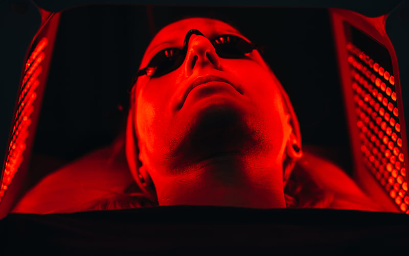 Woman doing red light therapy