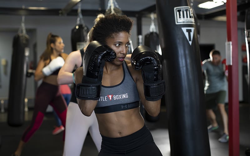 Woman boxing at TITLE Boxing Club