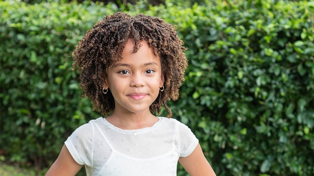 Young girl with curly textured hair