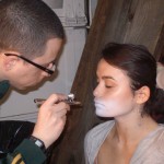 OCC's David Klasfeld applying airbrush makeup