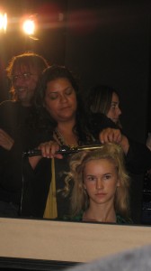 Amy Farid uses a marcel curling iron to create natural looking waves.