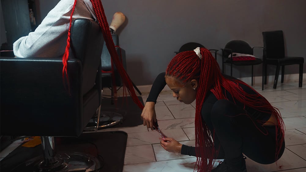 Hairstylist doing braids