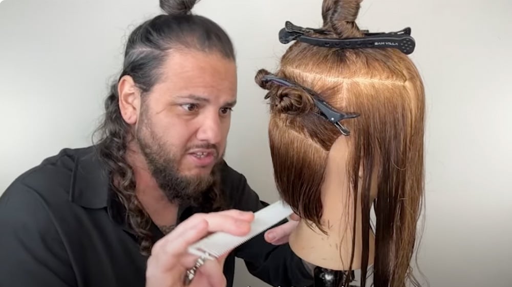 Roger Molina giving a video haircutting tutorial