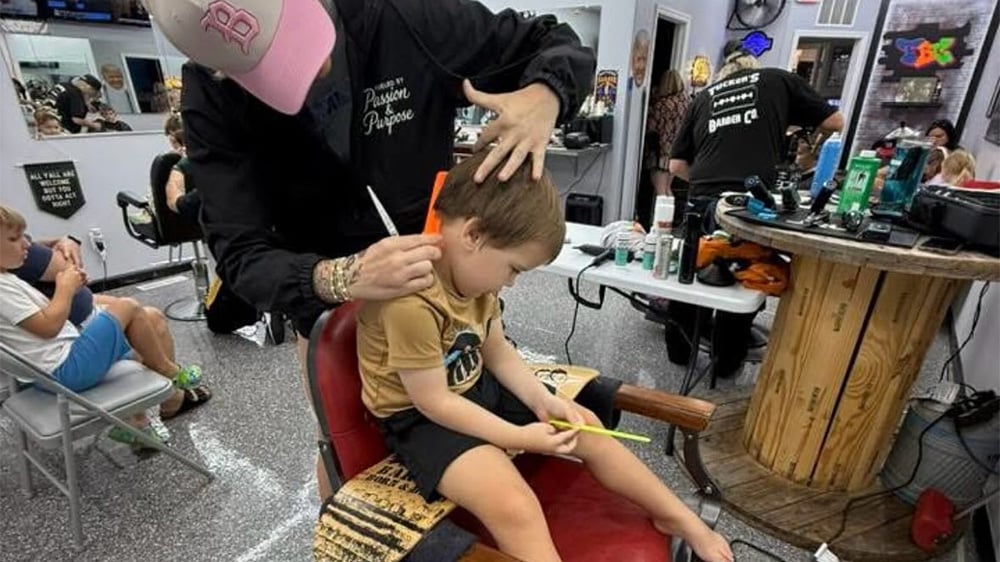 Tennessee barber Holly Skornik gives a child with autism his first professional haircut