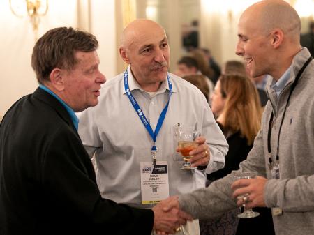 Club Industry friends shaking hands