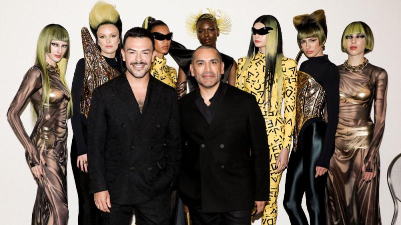 Luis Gonzalez and Allen Ruiz with models for their CAUTION collection.