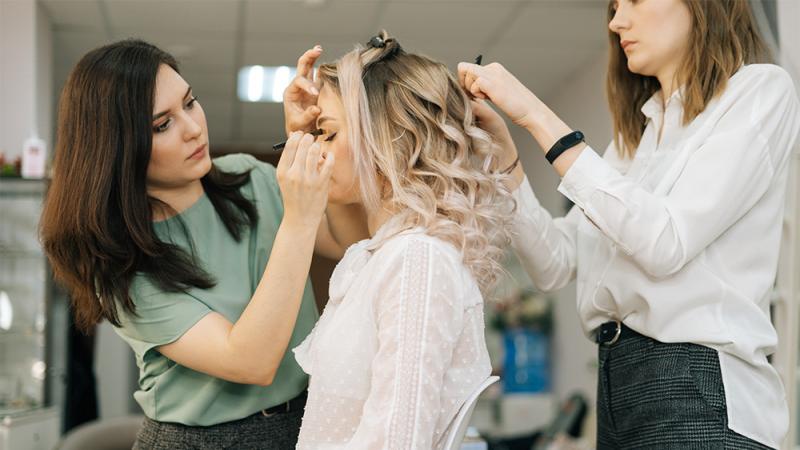 Model getting hair and makeup done