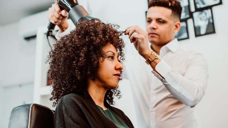 Stylist and client with textured hair