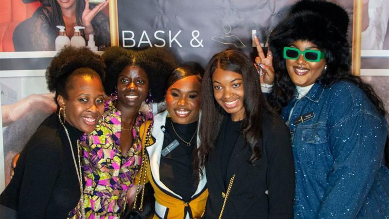 Shaina Rainford (center) with Bask & Lather customers during a meet-and-greet.