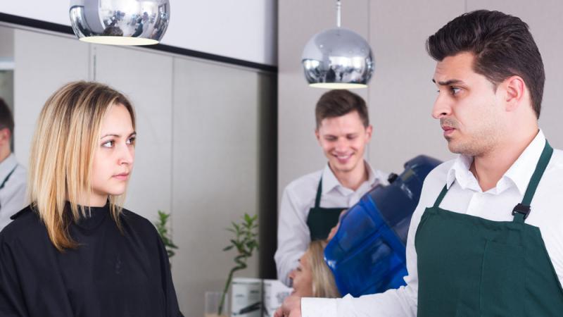 Client and stylist having uncomfortable conversation